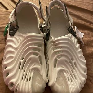 Brand new crocs, style, white, and clear sandal, Velcro by the heel futuristic